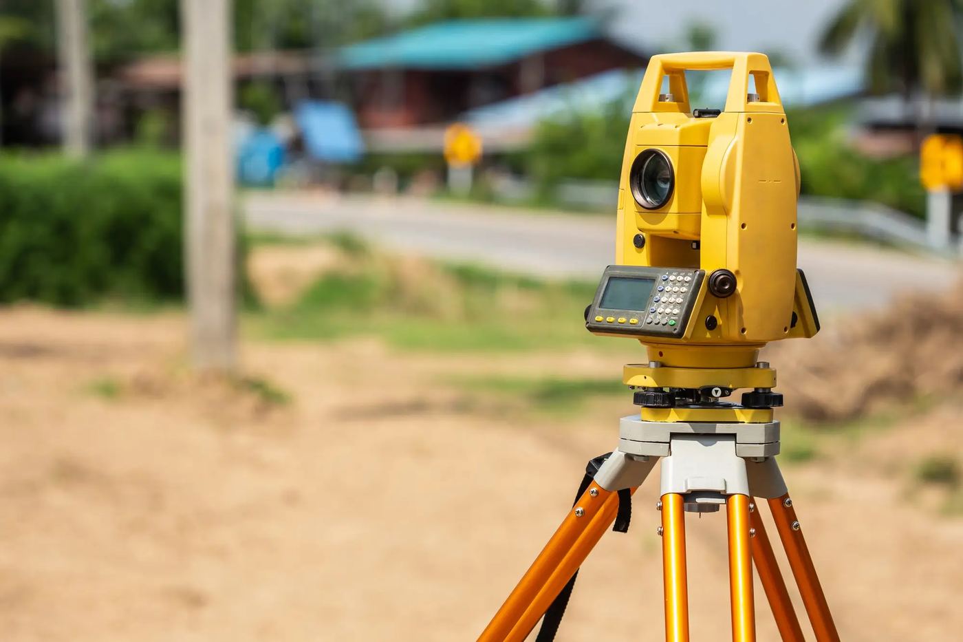 Yellow total station on a tripod at a Sydney site